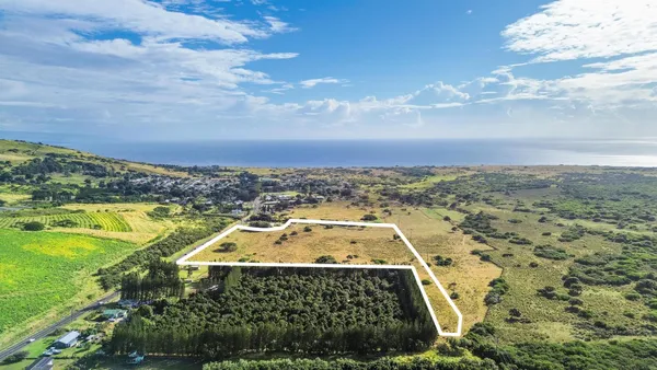 a view of a swimming pool with an ocean view