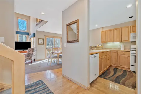 a kitchen with a sink cabinets and window
