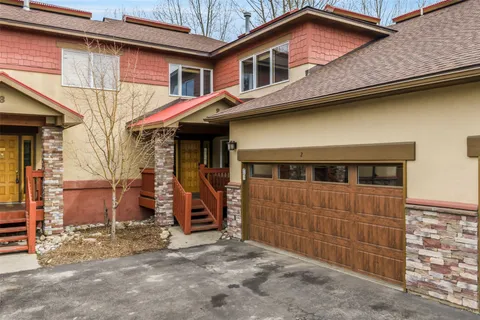 a front view of a house with parking