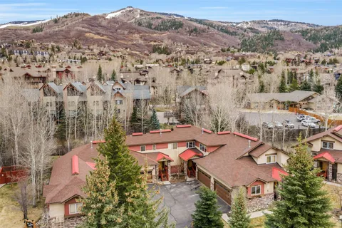 an aerial view of residential houses with outdoor space