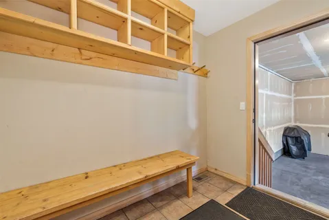 a view of a room with rack and the stairs