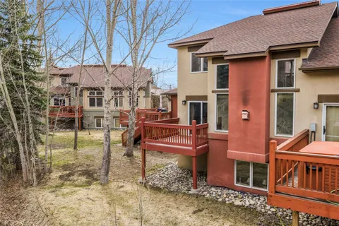 a wooden bench sitting in front of a building