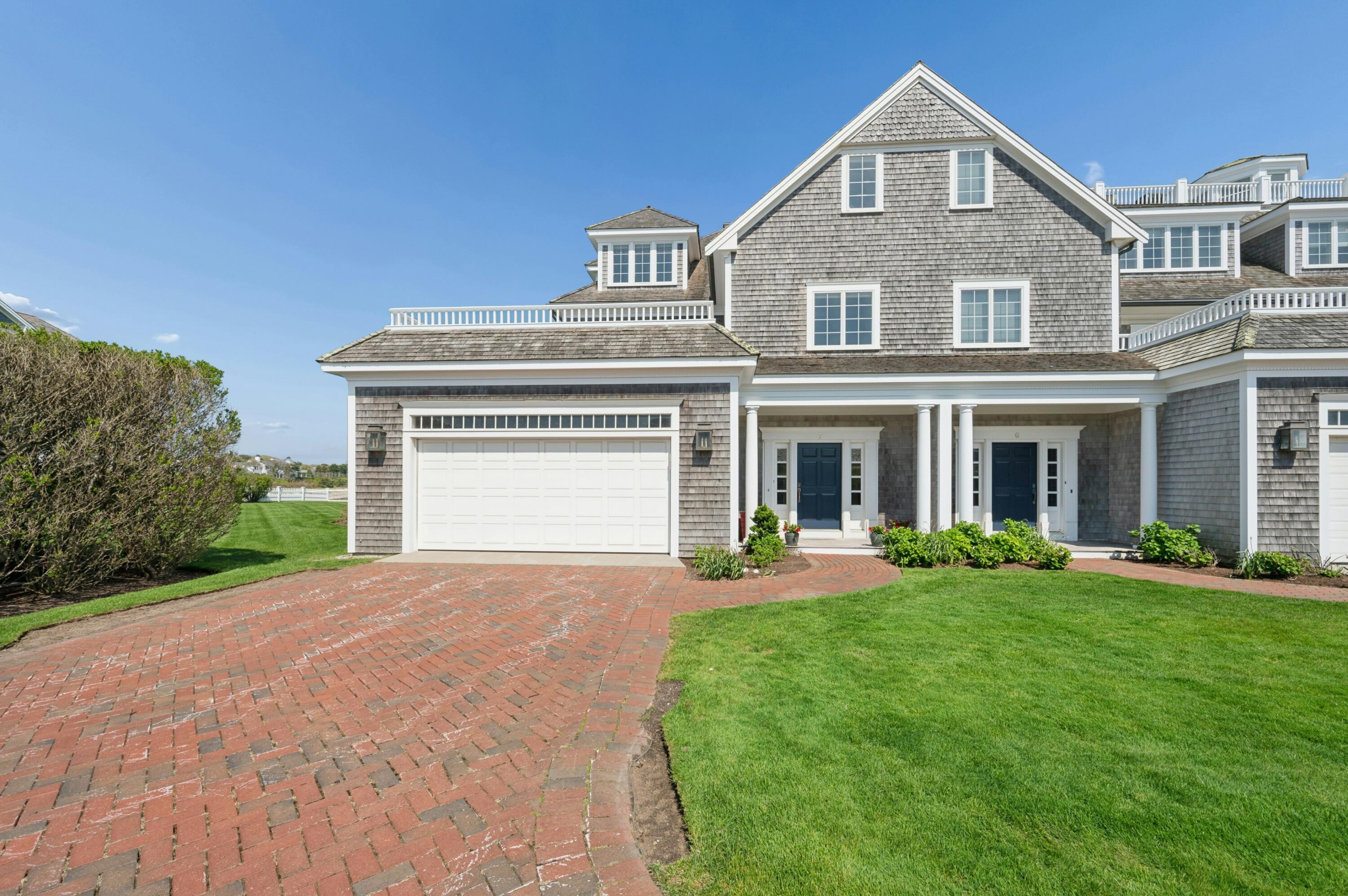 23 Snow Inn Road, Unit 7 Harwich Port, MA 02646 - Photo 6 of 37 front view of a brick house with a yard