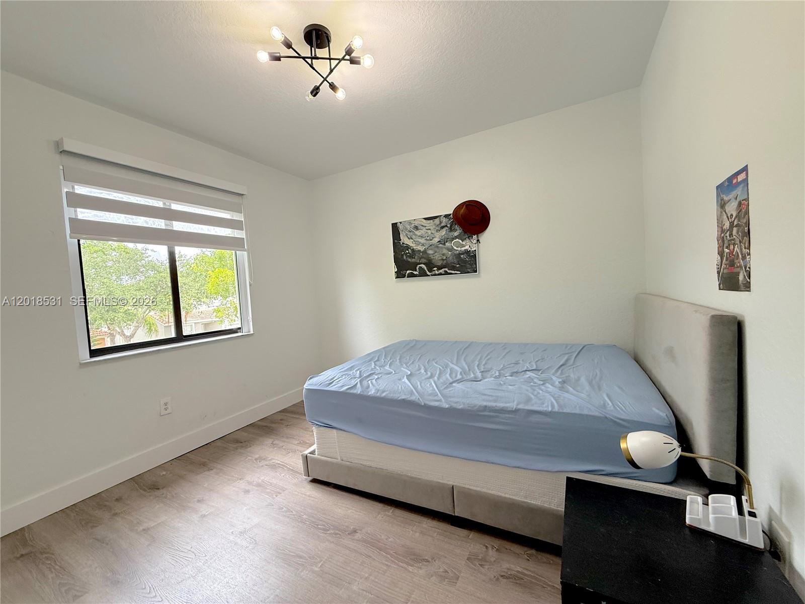 1575 Southeast 20th Road Homestead, FL 33035 - Photo 12 of 19 a bedroom with bed and a window