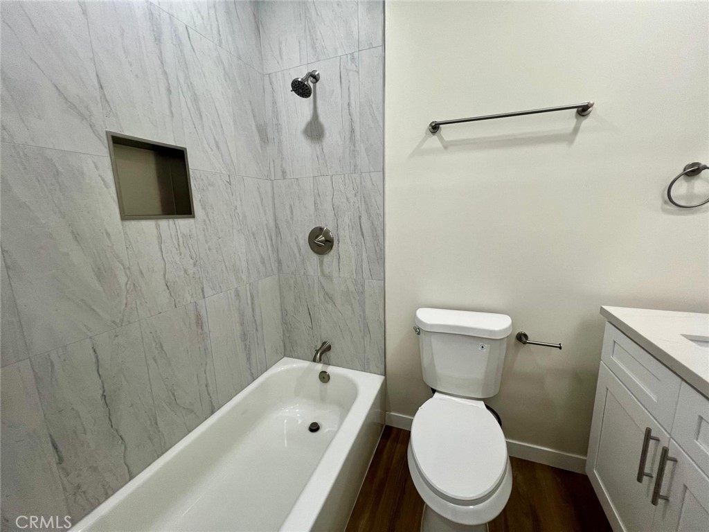 354 Chestnut Avenue, Unit 29 Long Beach, CA 90802 - Photo 11 of 19 a white toilet sitting next to a bath tub