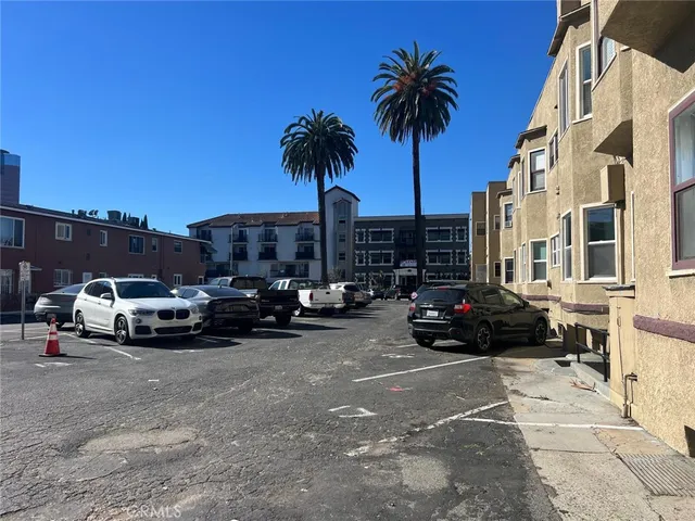 a view of car parked in front of a building