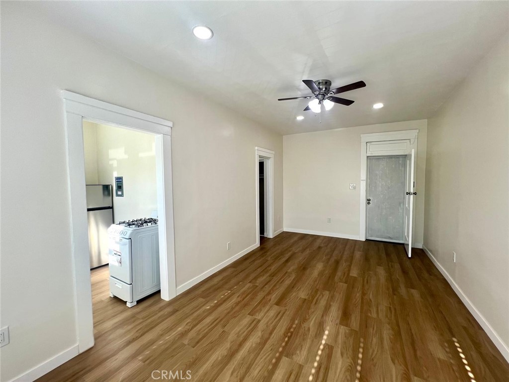 354 Chestnut Avenue, Unit 29 Long Beach, CA 90802 - Photo 5 of 19 a view of empty room with wooden floor and ceiling fan