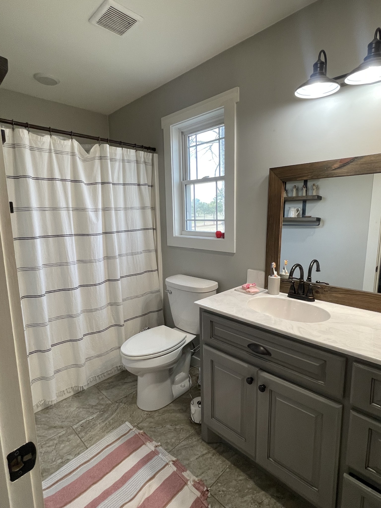 1875 Fall River Road Leoma, TN 38468 - Photo 16 of 18 a bathroom with a granite countertop sink toilet a mirror and shower