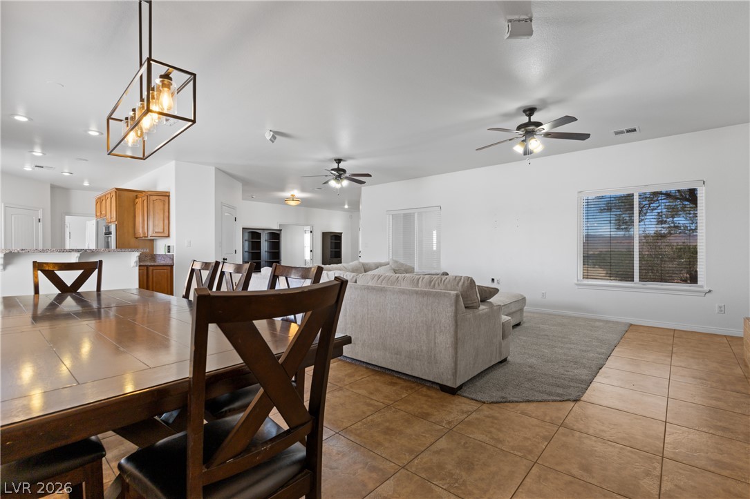 575 Gann Avenue Logandale, NV 89021 - Photo 25 of 75 An open-concept great room offers seamless transitions from dining to living, ideal for gathering.