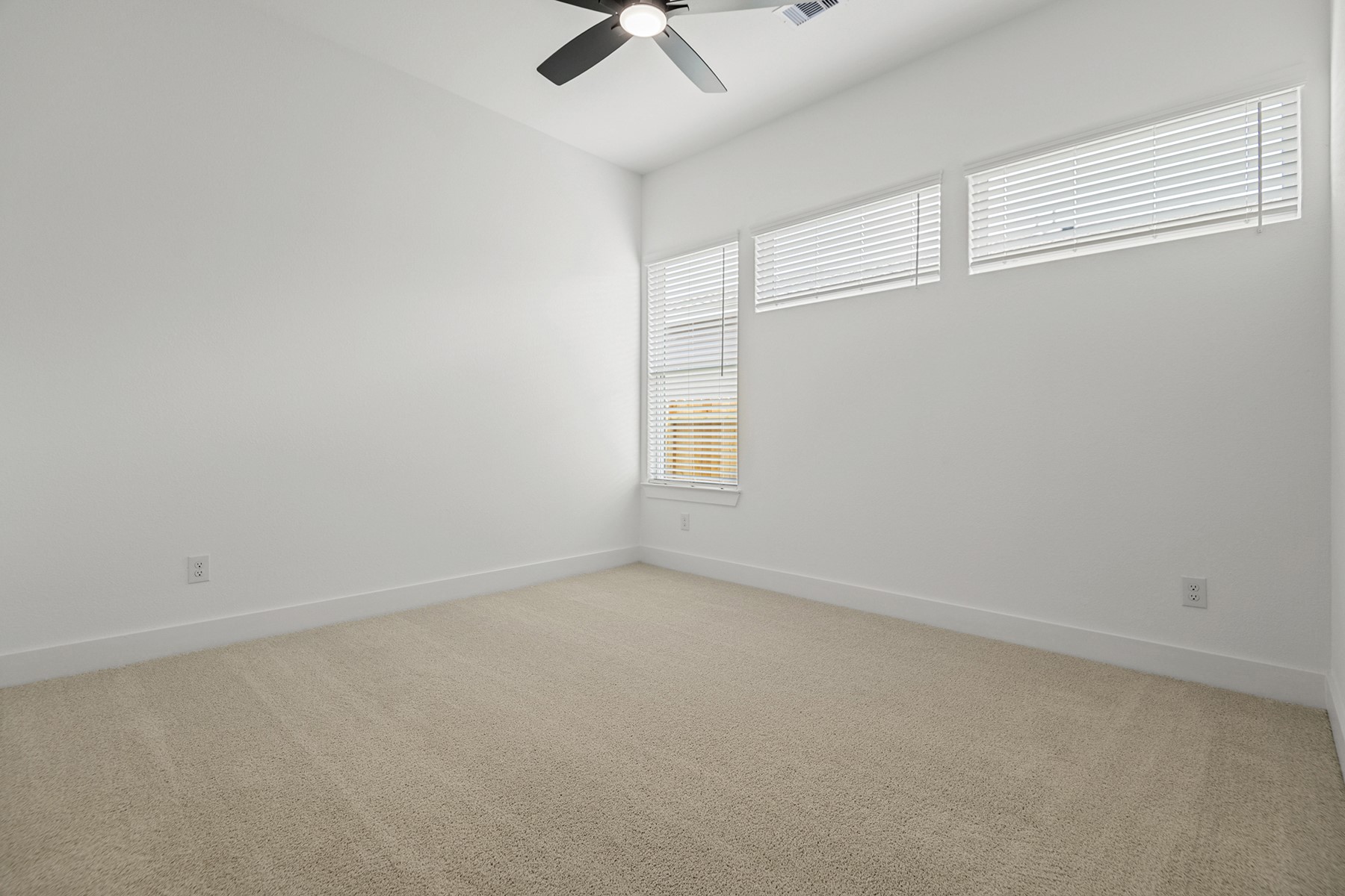 1813 Drover Lane Rosenberg, TX 77471 - Photo 20 of 23 an empty room with a window and a ceiling fan