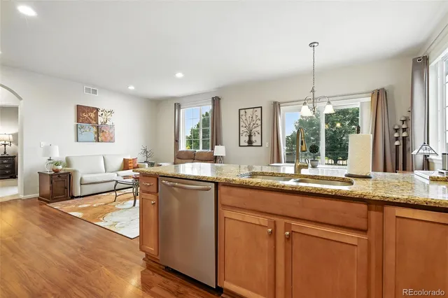 a kitchen with lots of counter top space and living room