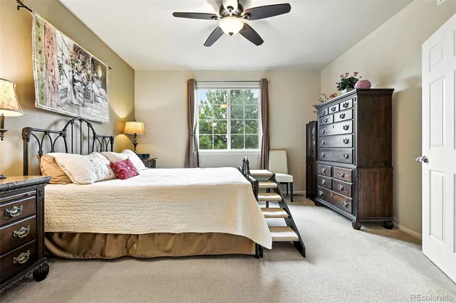 a bedroom with a bed and cabinets