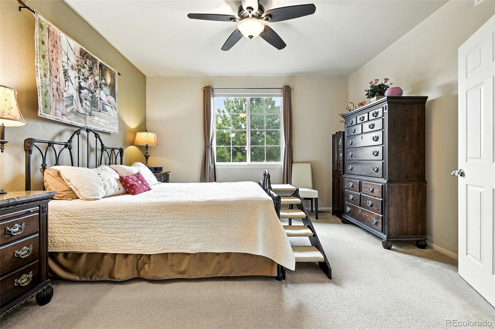 12804 Harrison Street Thornton, CO 80241 - Photo 19 of 37 a bedroom with a bed and cabinets