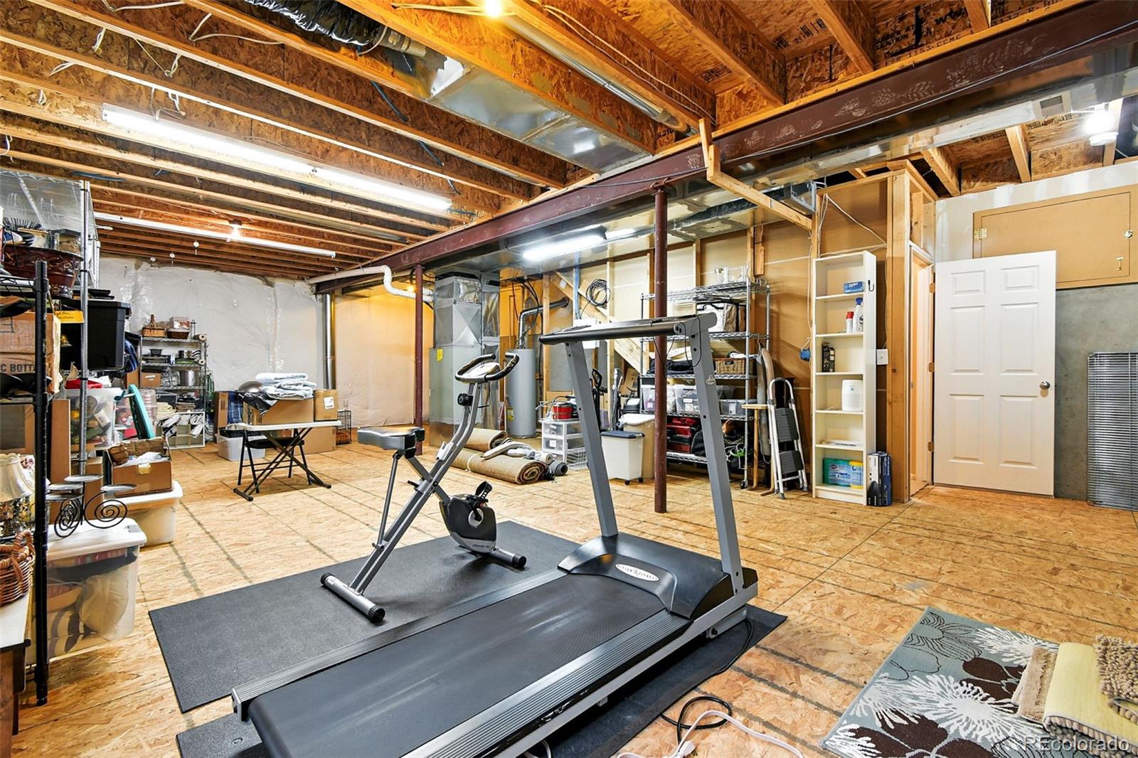 12804 Harrison Street Thornton, CO 80241 - Photo 32 of 37 a view of a gym with wooden floor