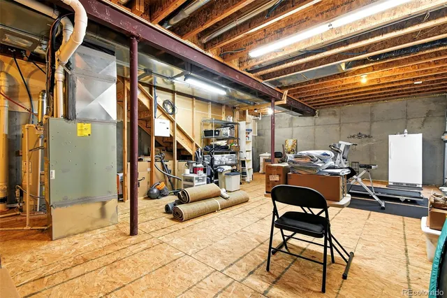 a building outdoor space with patio furniture and potted plants