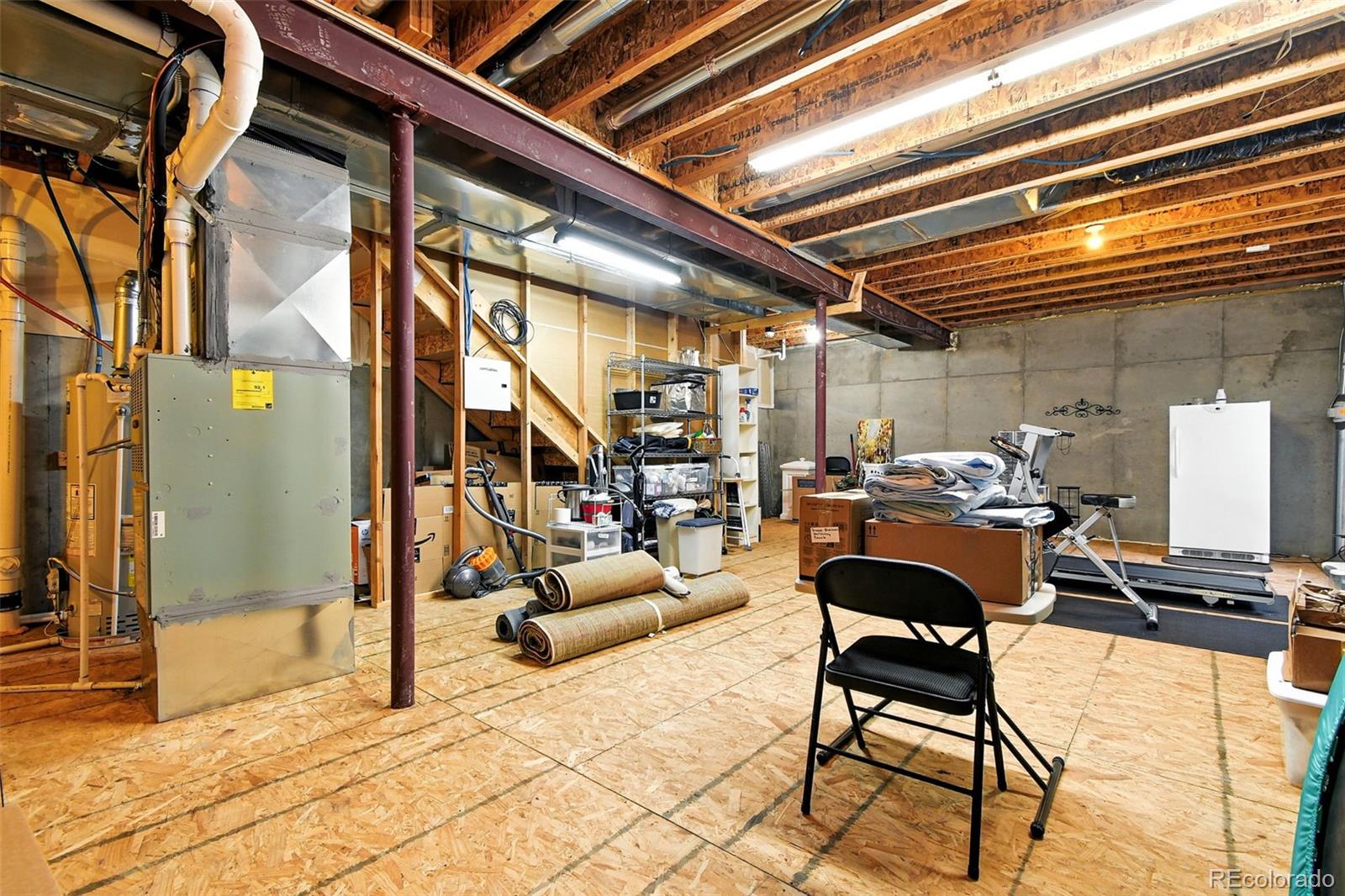 12804 Harrison Street Thornton, CO 80241 - Photo 33 of 37 a building outdoor space with patio furniture and potted plants