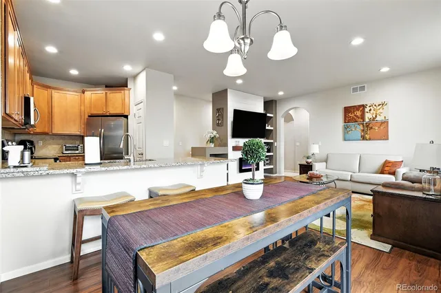 a kitchen with a dining table and chairs