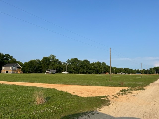 0 Alfred Ray Road Waynesboro, TN 38485 - Photo 6 of 14 a view of a golf course with a lake