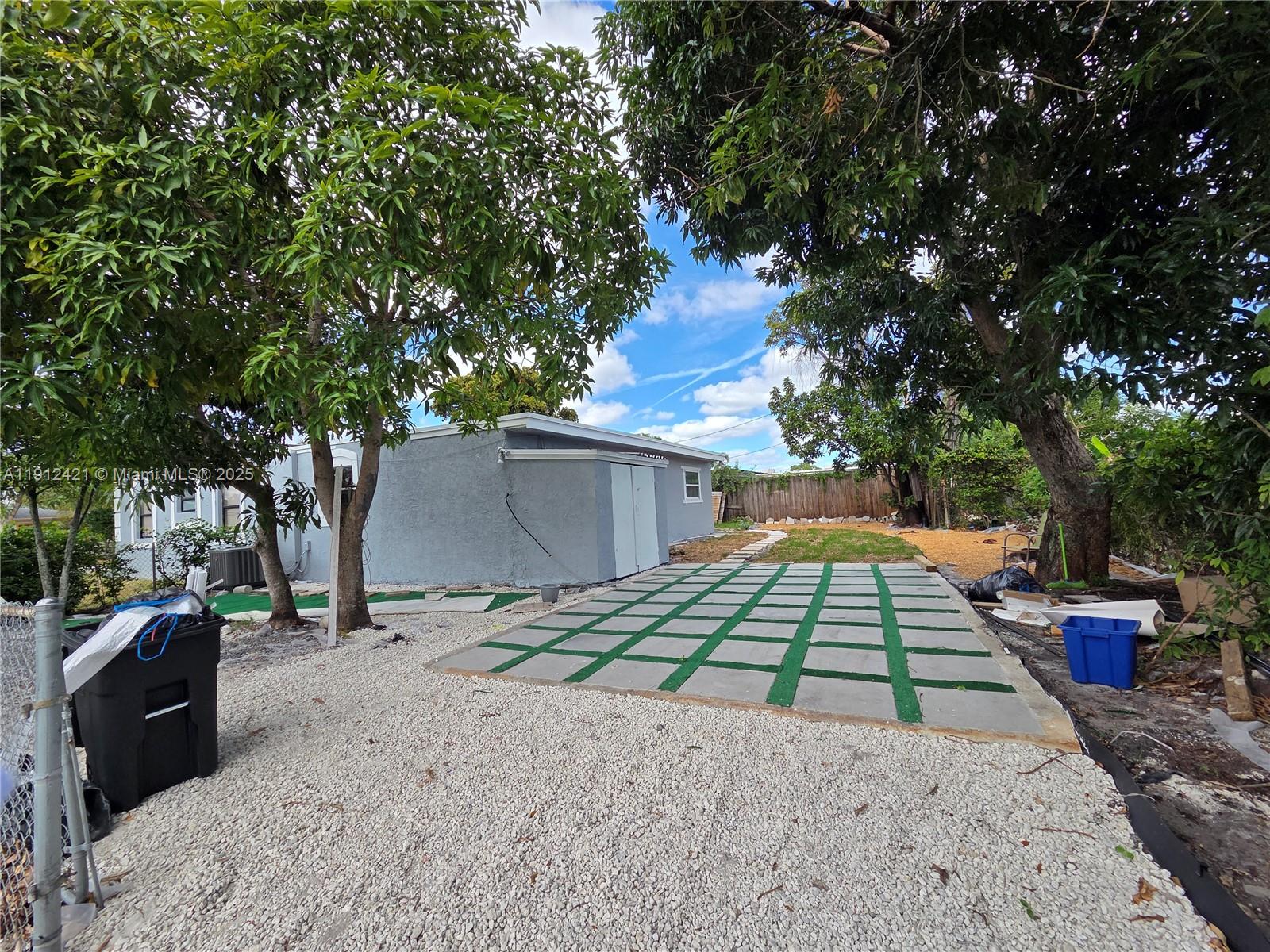 2124 South Beech Road, Unit B West Palm Beach, FL 33409 - Photo 2 of 12 a front view of a house with a yard