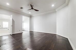 1318 Peden Street, Unit D Houston, TX 77006 - Photo 13 of 33 a view of an empty room with window and wooden floor