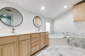 1318 Peden Street, Unit D Houston, TX 77006 - Photo 17 of 33 a bathroom with a double vanity sink and a mirror