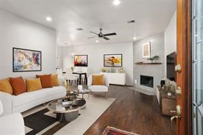 1318 Peden Street, Unit D Houston, TX 77006 - Photo 3 of 33 a living room with furniture a fireplace and a flat screen tv