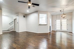 1318 Peden Street, Unit D Houston, TX 77006 - Photo 5 of 33 a view of an empty room with wooden floor and a window