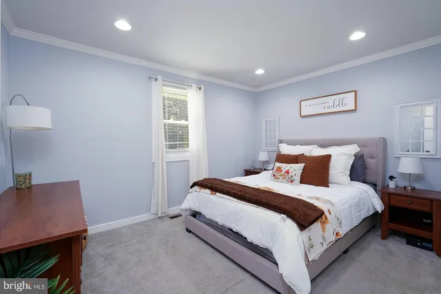 a bed room with a bed and a night stand