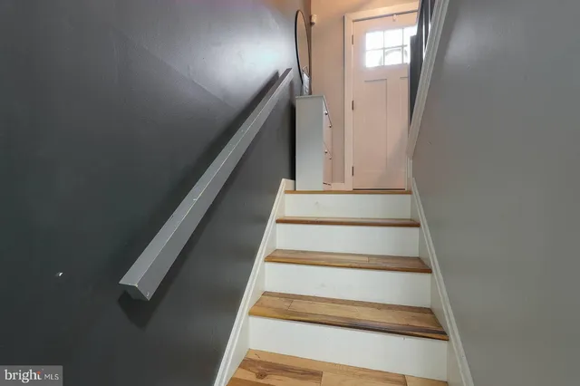 a bathroom with a toilet a sink and shower