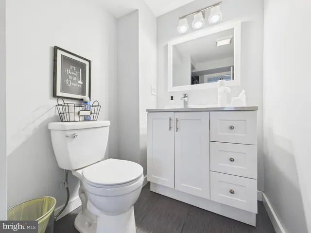a view of a house with a yard balcony and sitting area