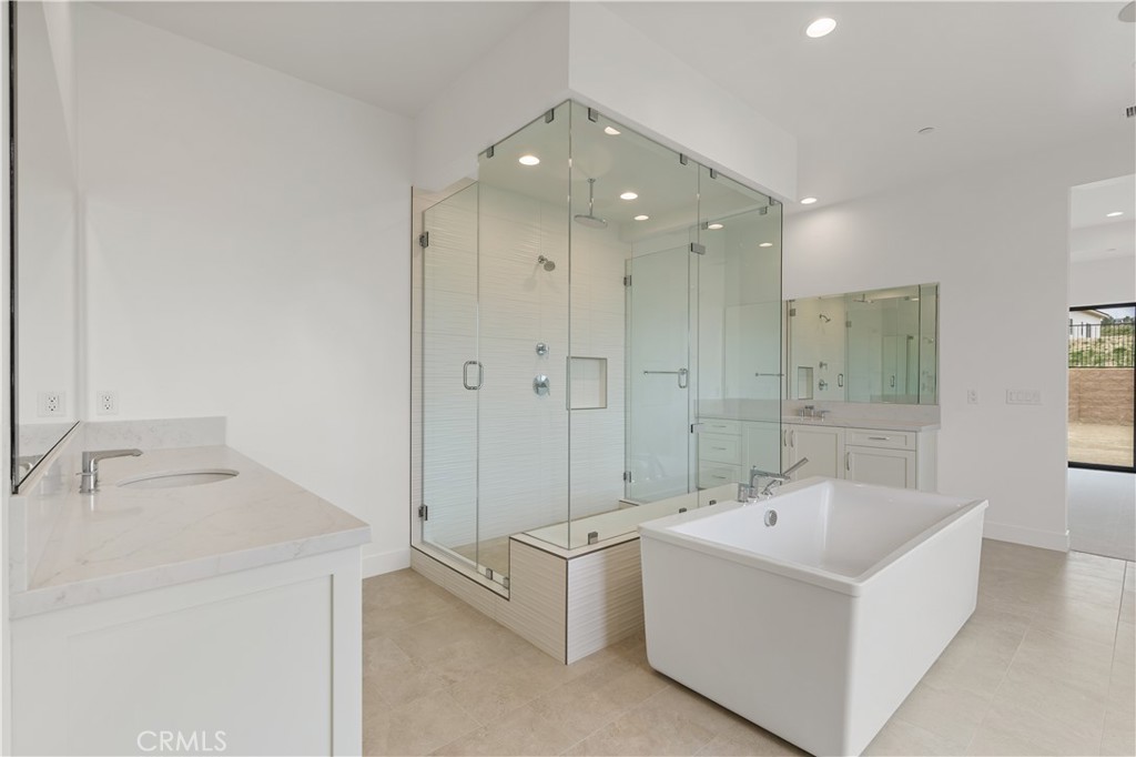 11864 Red Hawk Lane Porter Ranch, CA 91326 - Photo 11 of 15 a bathroom with a bathtub and a sink