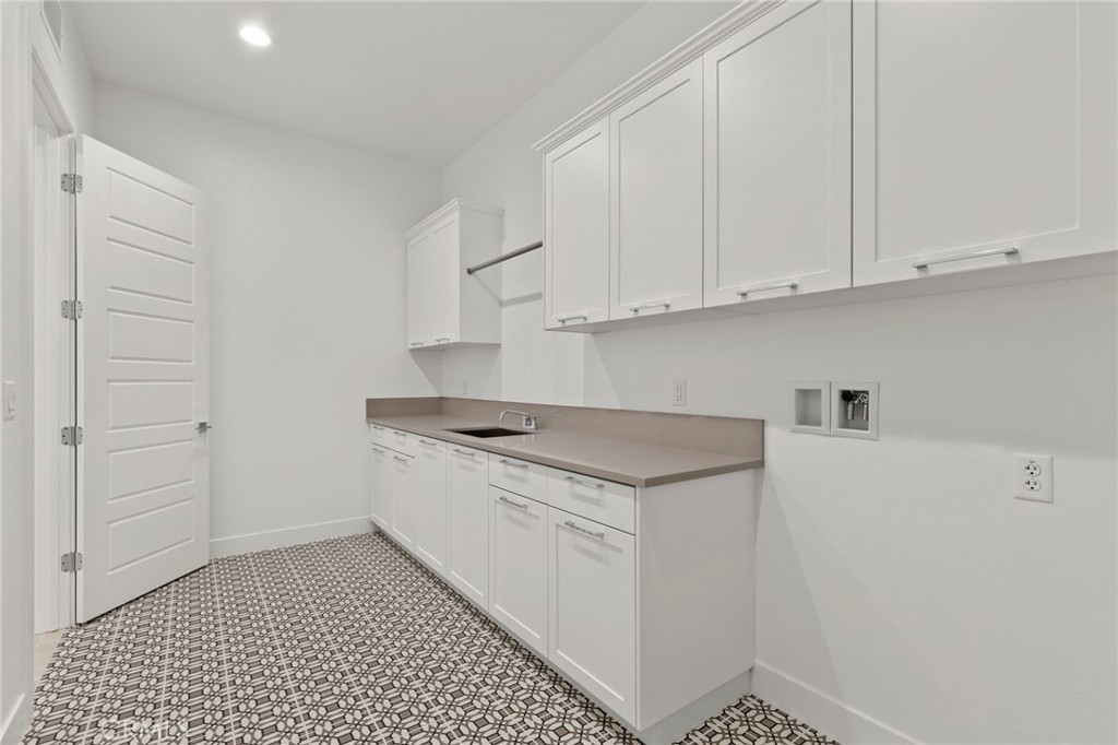 11864 Red Hawk Lane Porter Ranch, CA 91326 - Photo 15 of 19 Laundry Room: Alta Loma Italianate - Ridge Collection at Bella Vista - Photo of another Alta Loma - Not actual home for sale - Home is still under construction