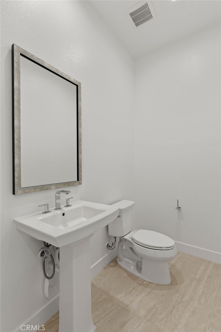 11864 Red Hawk Lane Porter Ranch, CA 91326 - Photo 6 of 19 Powder Room: Alta Loma Italianate - Ridge Collection at Bella Vista - Photo of another Alta Loma - Not actual home for sale - Home is still under construction