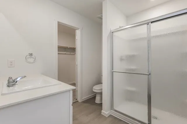 a bathroom with a sink double vanity and a mirror