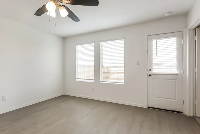 a kitchen with stainless steel appliances a refrigerator sink and microwave