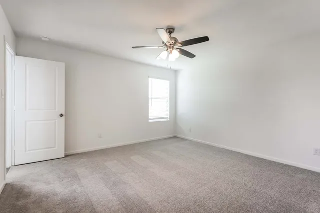 a bathroom with a shower sink vanity and toilet