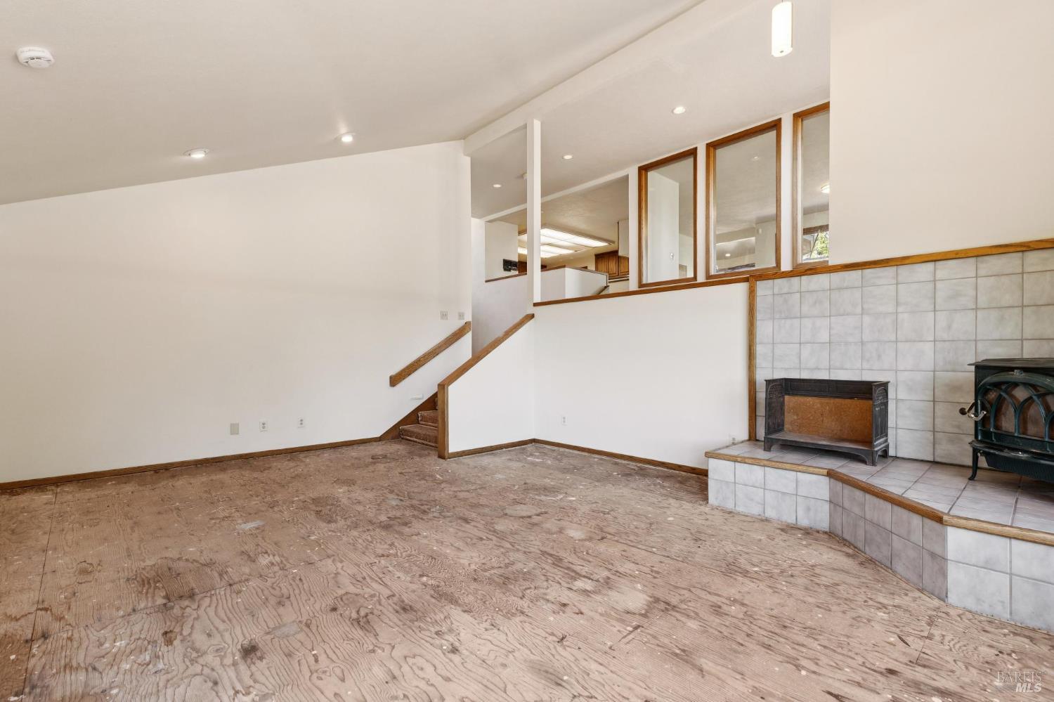 21540 Siri Road Guerneville, CA 95446 - Photo 13 of 99 a view of an empty room with a fireplace