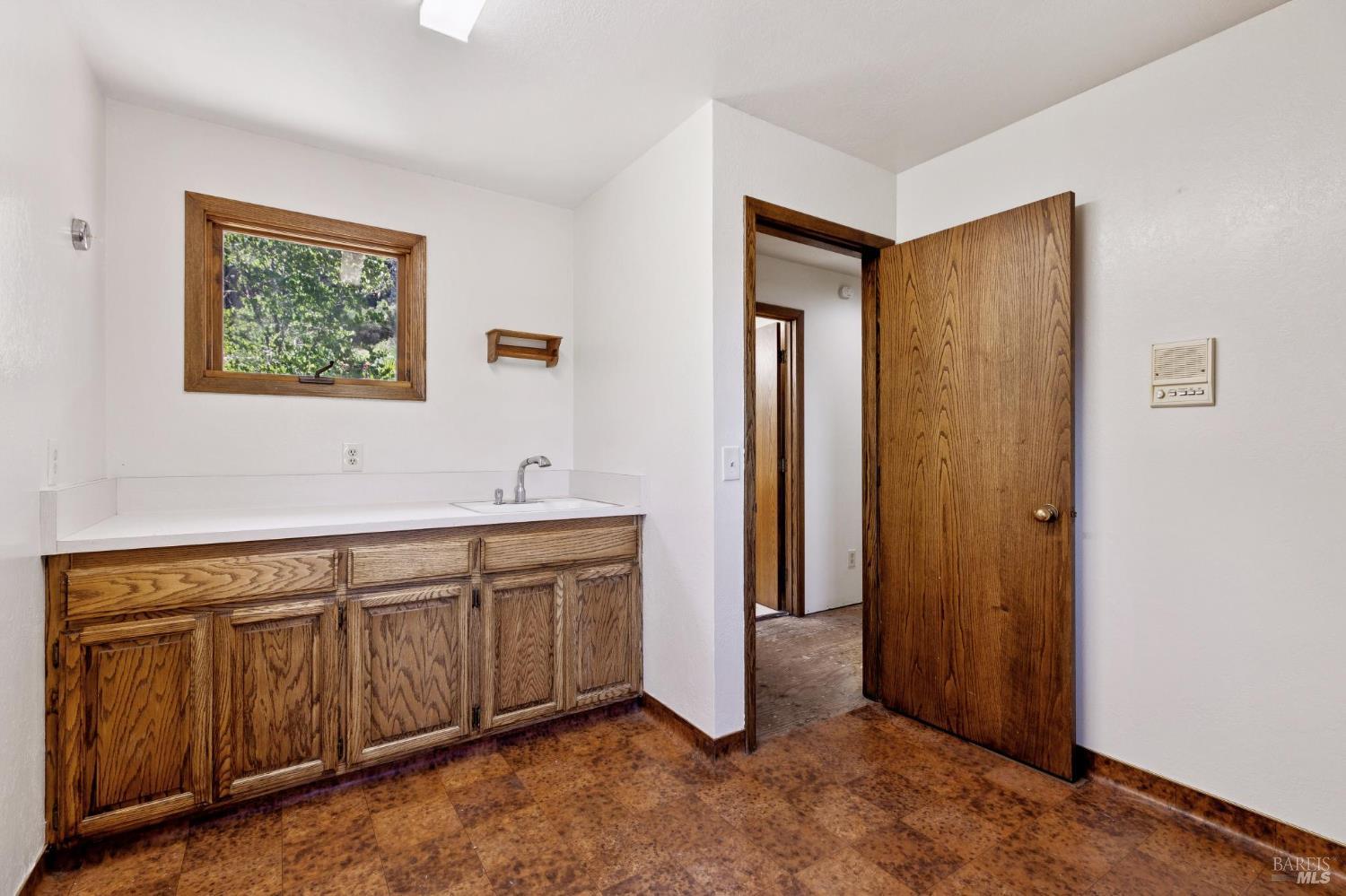 21540 Siri Road Guerneville, CA 95446 - Photo 15 of 99 a spacious bathroom with a double vanity sink and a mirror