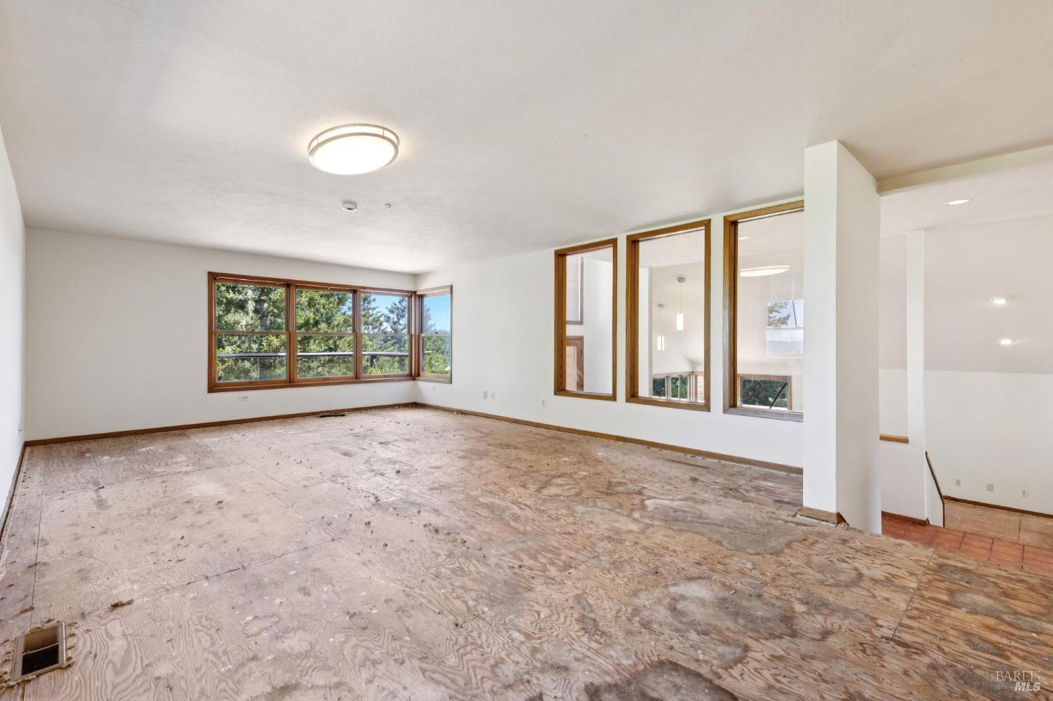 21540 Siri Road Guerneville, CA 95446 - Photo 16 of 99 an empty room with windows