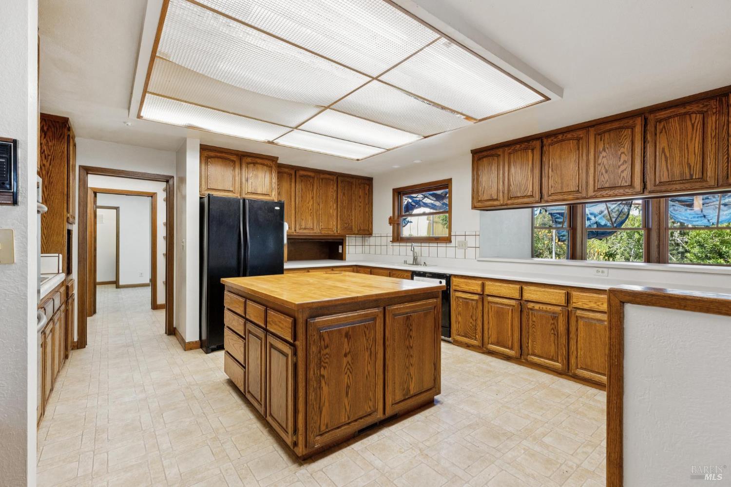 21540 Siri Road Guerneville, CA 95446 - Photo 21 of 99 a kitchen with a stove a refrigerator and a sink