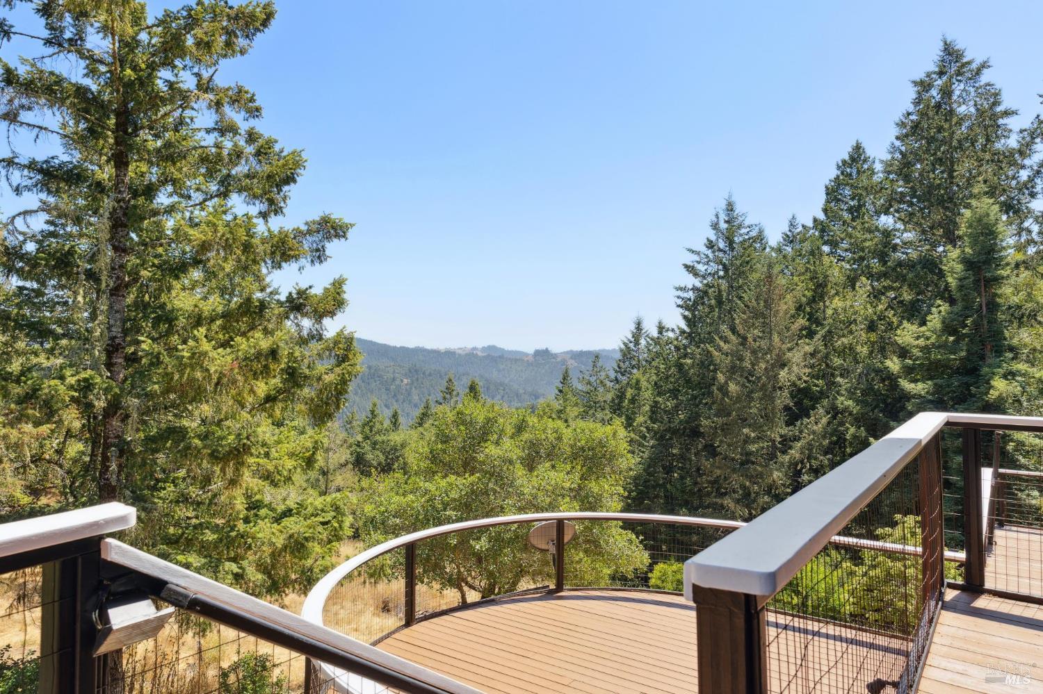 21540 Siri Road Guerneville, CA 95446 - Photo 46 of 99 a view of a balcony with wooden fence and floor