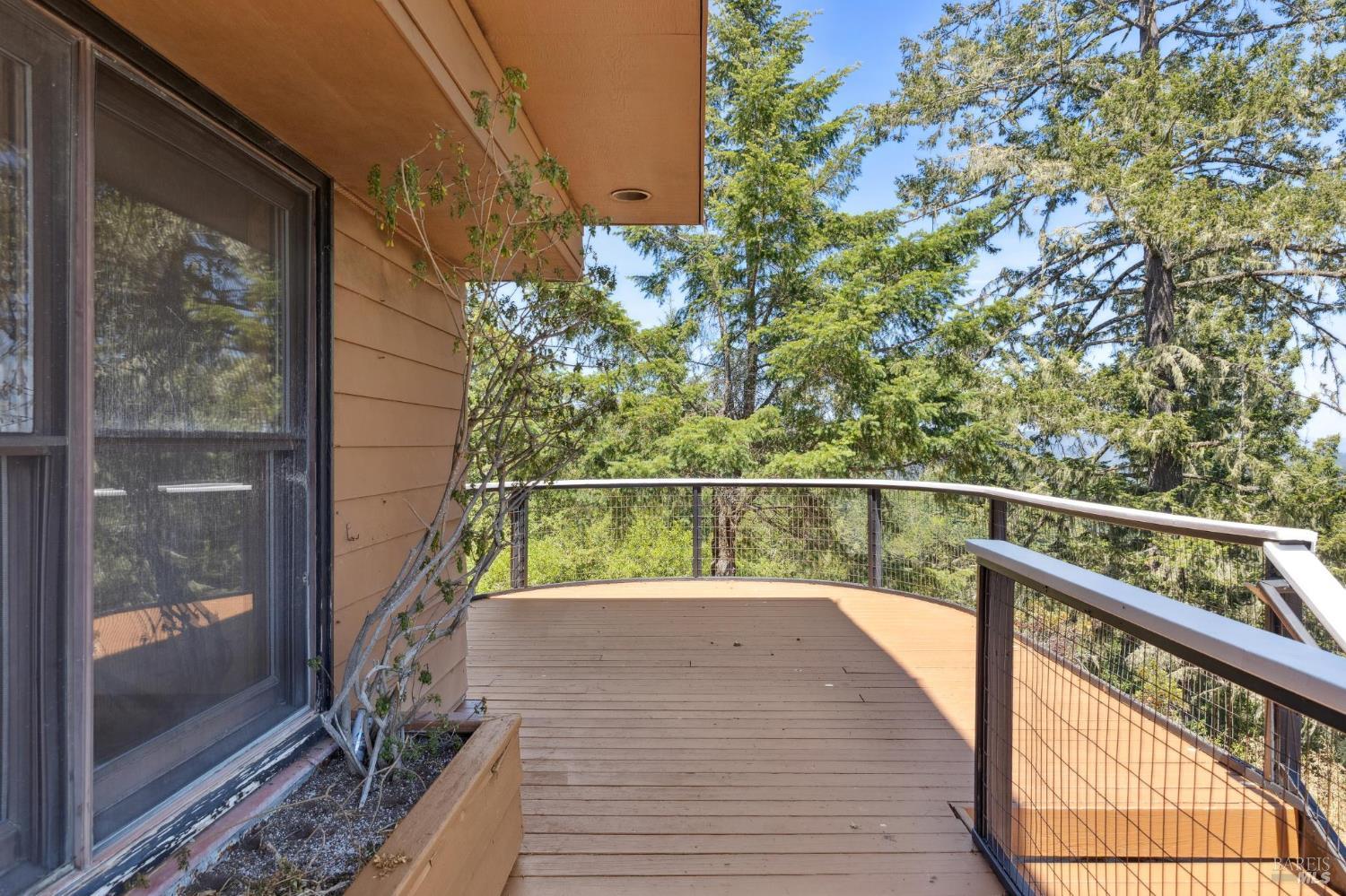 21540 Siri Road Guerneville, CA 95446 - Photo 47 of 99 a view of balcony with a potted plant