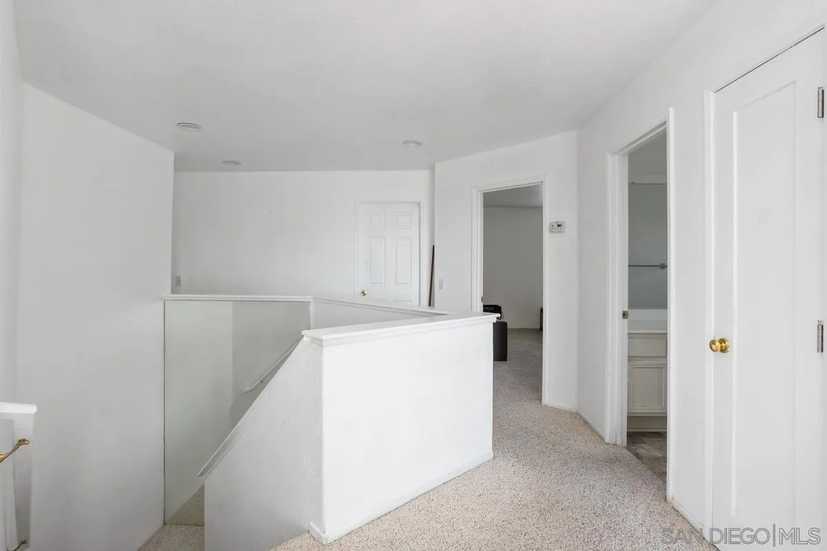 408 Shadow Tree Drive Oceanside, CA 92058 - Photo 12 of 29 a view of storage and utility room with refrigerator