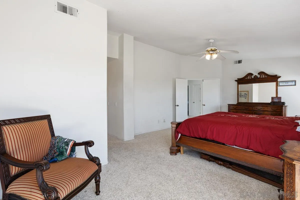 408 Shadow Tree Drive Oceanside, CA 92058 - Photo 15 of 29 a bedroom with a bed and chair