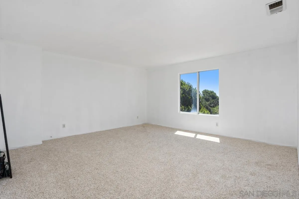 408 Shadow Tree Drive Oceanside, CA 92058 - Photo 18 of 29 an empty room with windows
