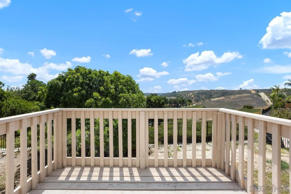 408 Shadow Tree Drive Oceanside, CA 92058 - Photo 2 of 29 a view of a wooden fence