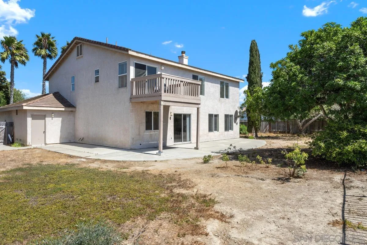 408 Shadow Tree Drive Oceanside, CA 92058 - Photo 24 of 29 a front view of a house with a yard