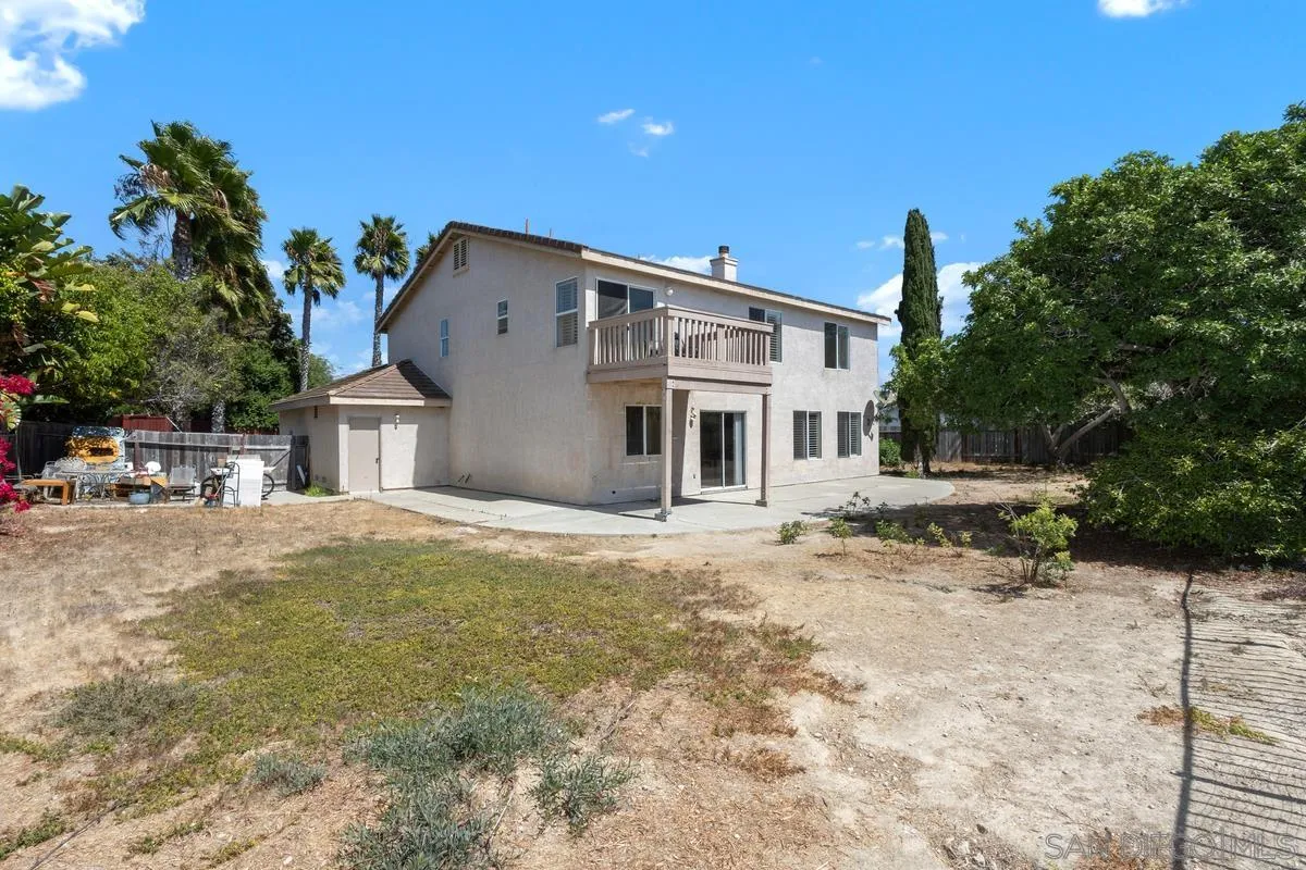 408 Shadow Tree Drive Oceanside, CA 92058 - Photo 25 of 29 a view of a house with a yard