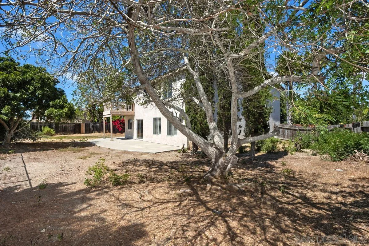 408 Shadow Tree Drive Oceanside, CA 92058 - Photo 27 of 29 a white house that has a tree in front of it