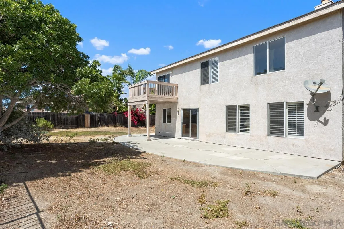 408 Shadow Tree Drive Oceanside, CA 92058 - Photo 28 of 29 a front view of a house with a road